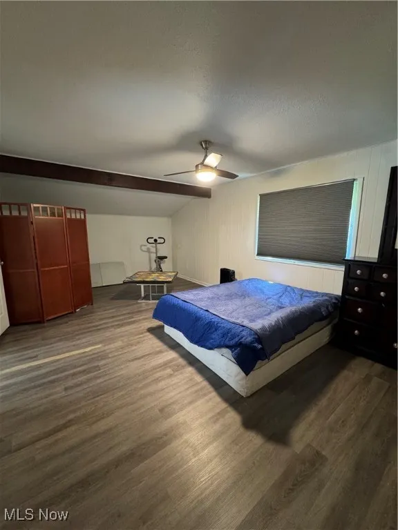 Bedroom featuring wood finished floors and a ceiling fan