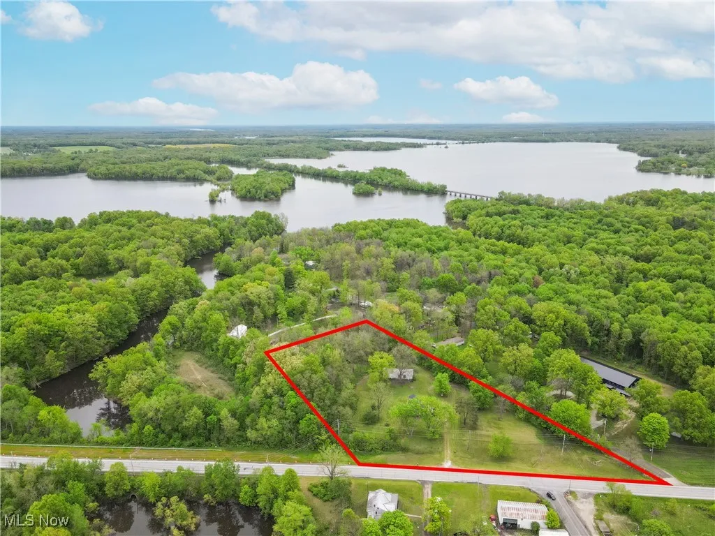 Berlin Lake is in the background. Berlin Lake property beside the house. Red lines are only to be used as reference not to scale.