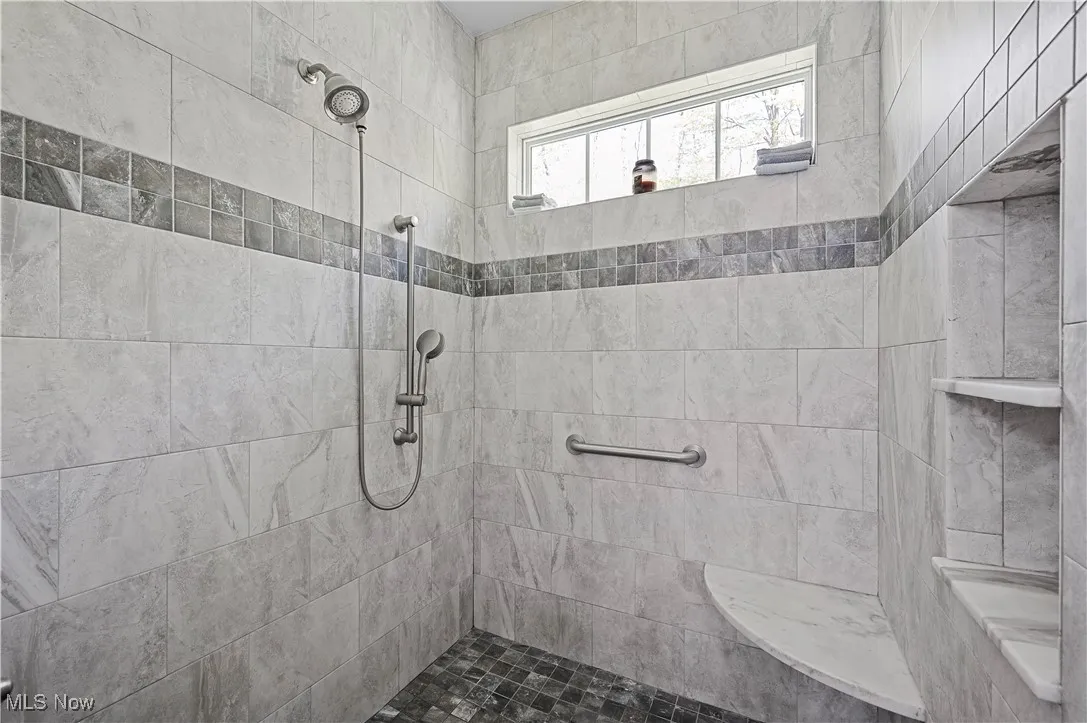 Bathroom with tiled shower