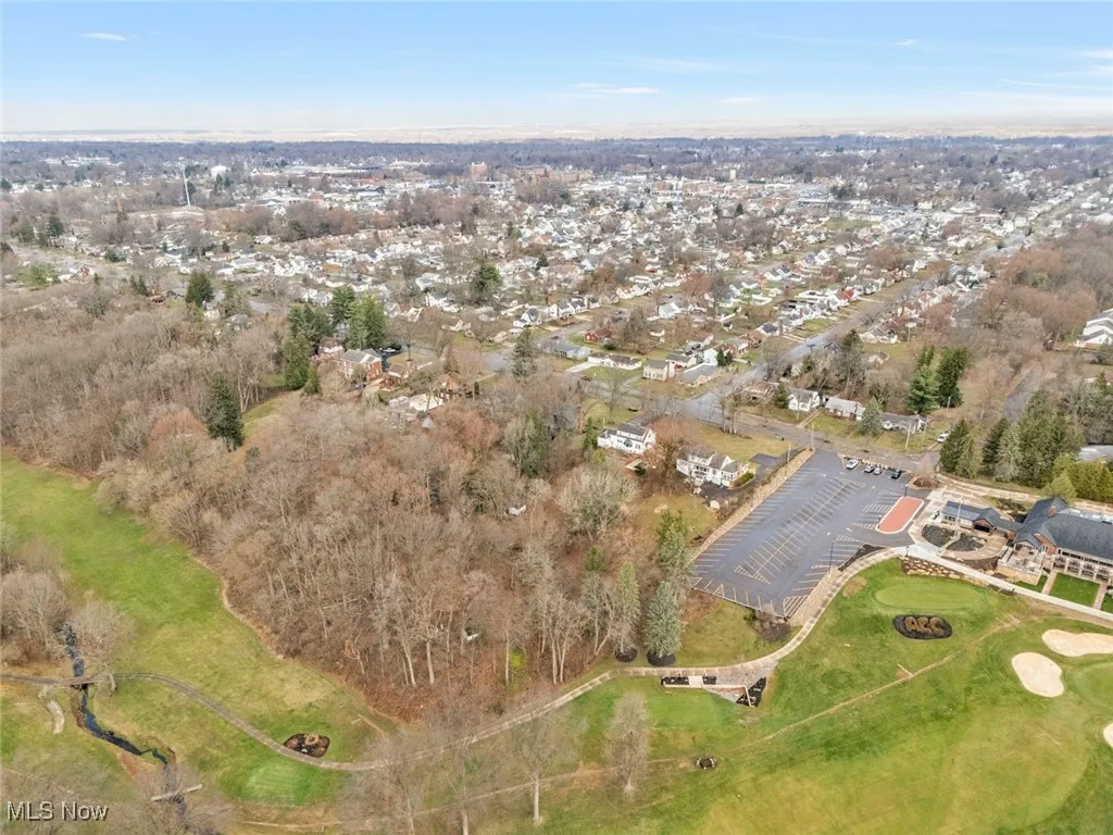 Aerial overview of property's location featuring nearby suburban area
