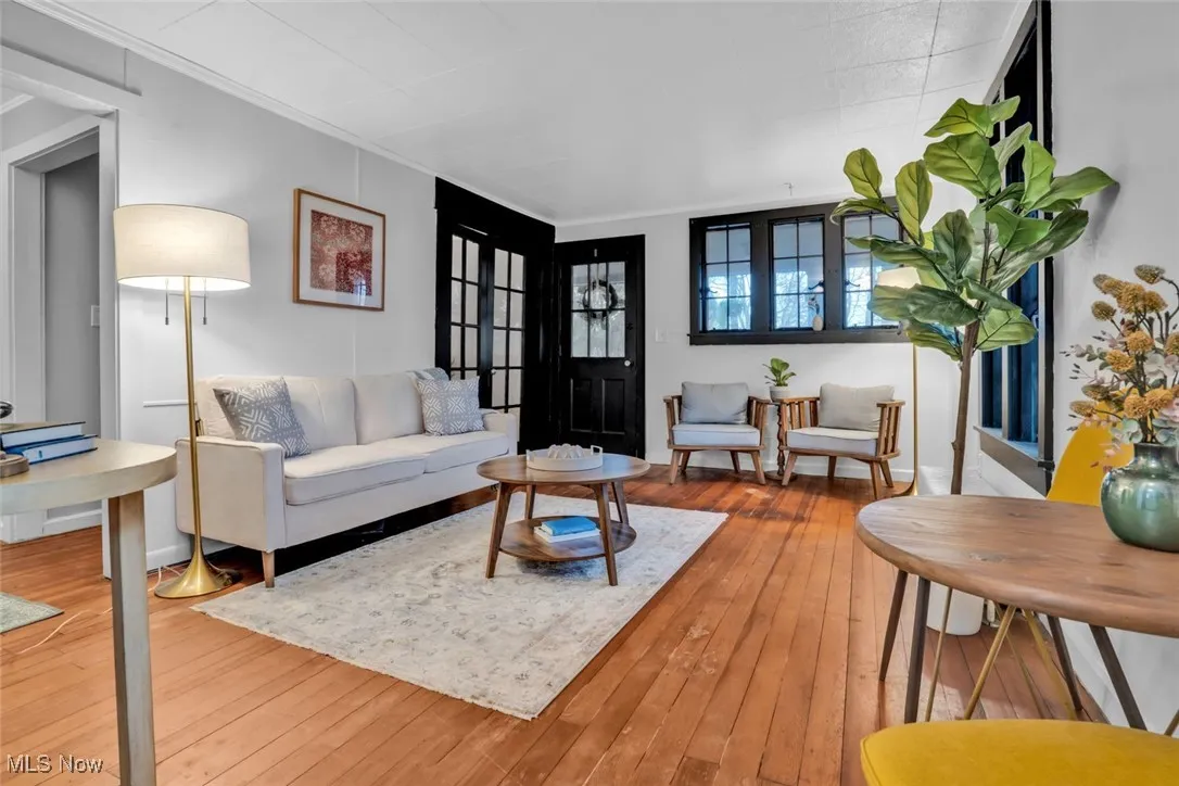 Living area with hardwood / wood-style flooring