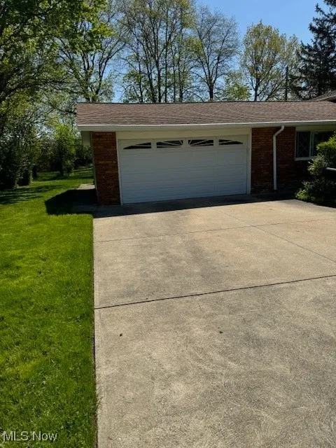 Garage with concrete driveway