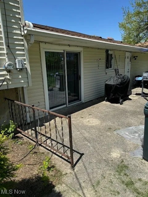 Back of property with a patio