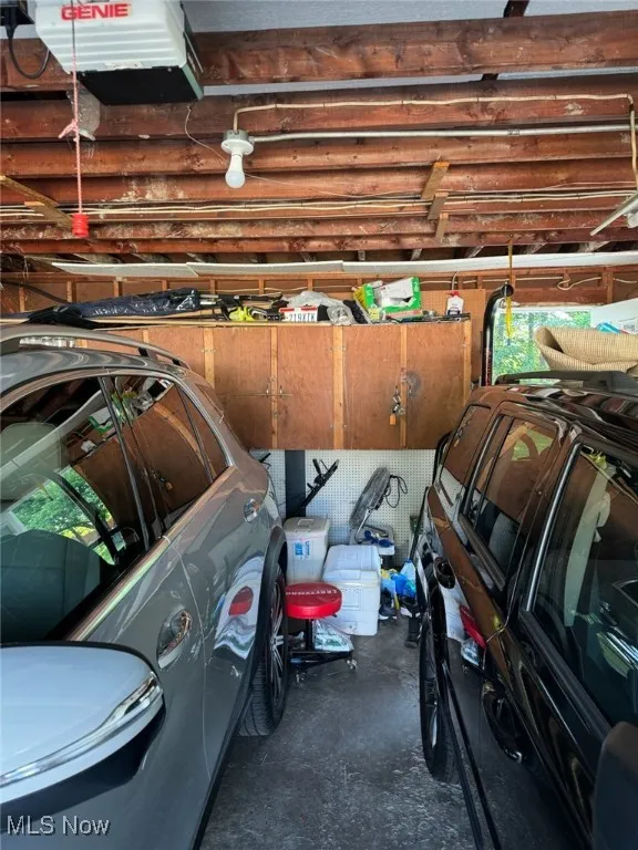 Garage featuring a garage door opener