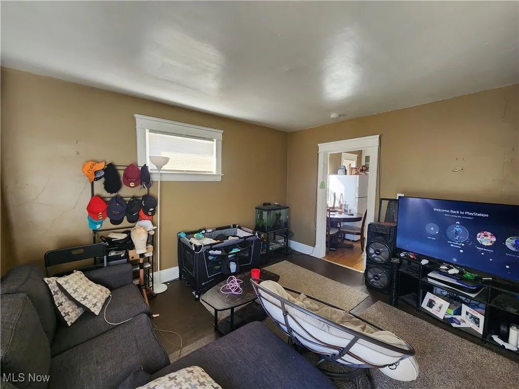 Living area featuring wood finished floors and baseboards