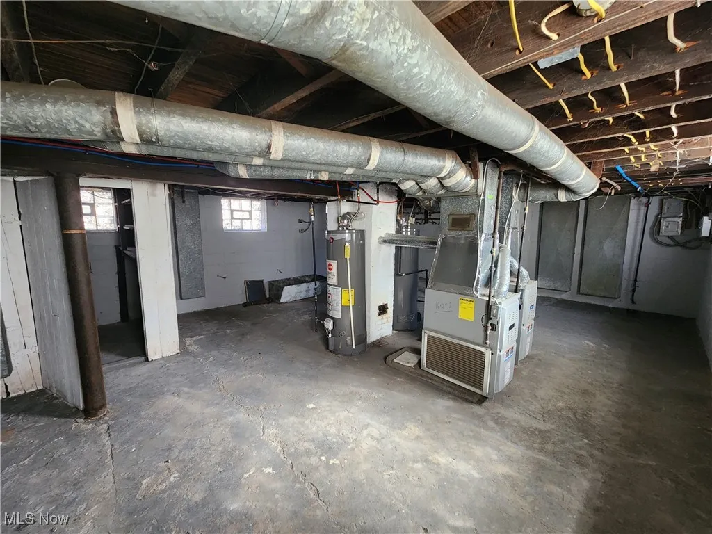 Below grade area with water heater and heating unit