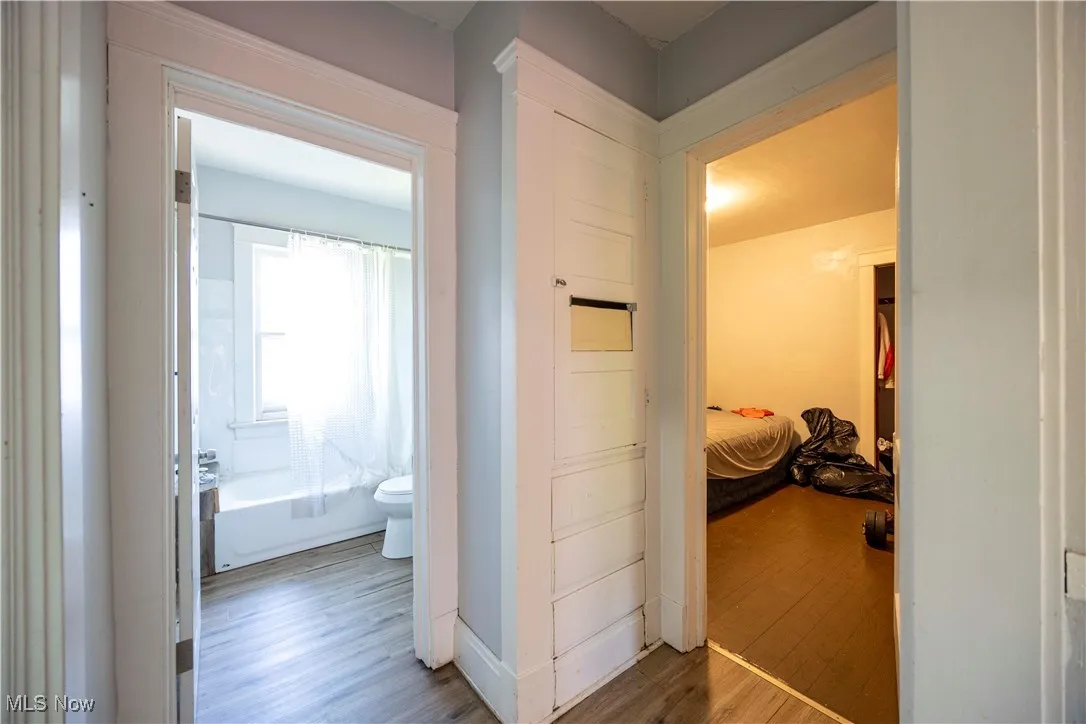 Hall featuring light wood finished floors