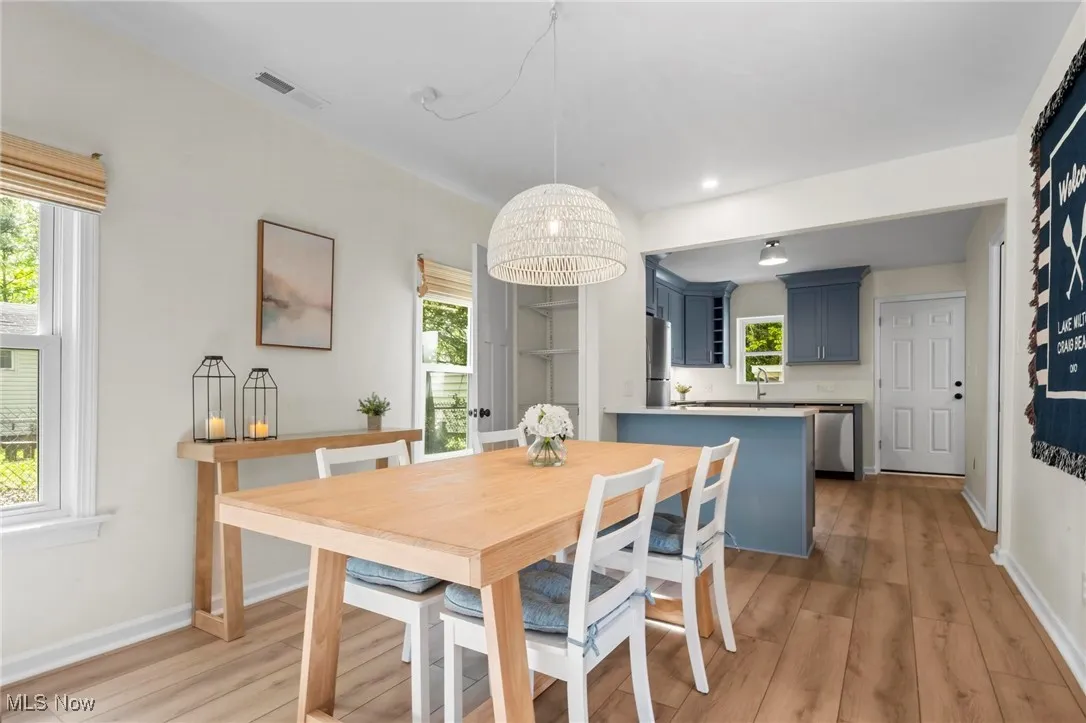 Dining room featuring light wood-type flooring, baseboards, and recessed lighting