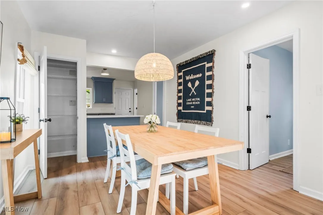 Dining space featuring light wood finished floors, recessed lighting, and baseboards