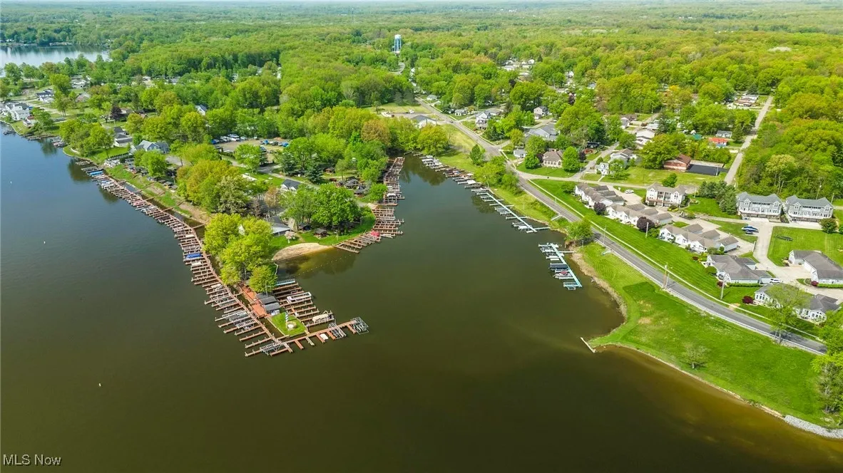 View of property location featuring a heavily wooded area and a large body of water