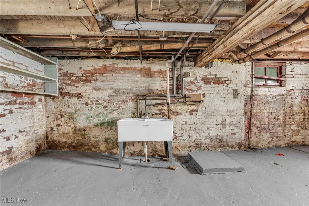 Unfinished basement featuring a sink