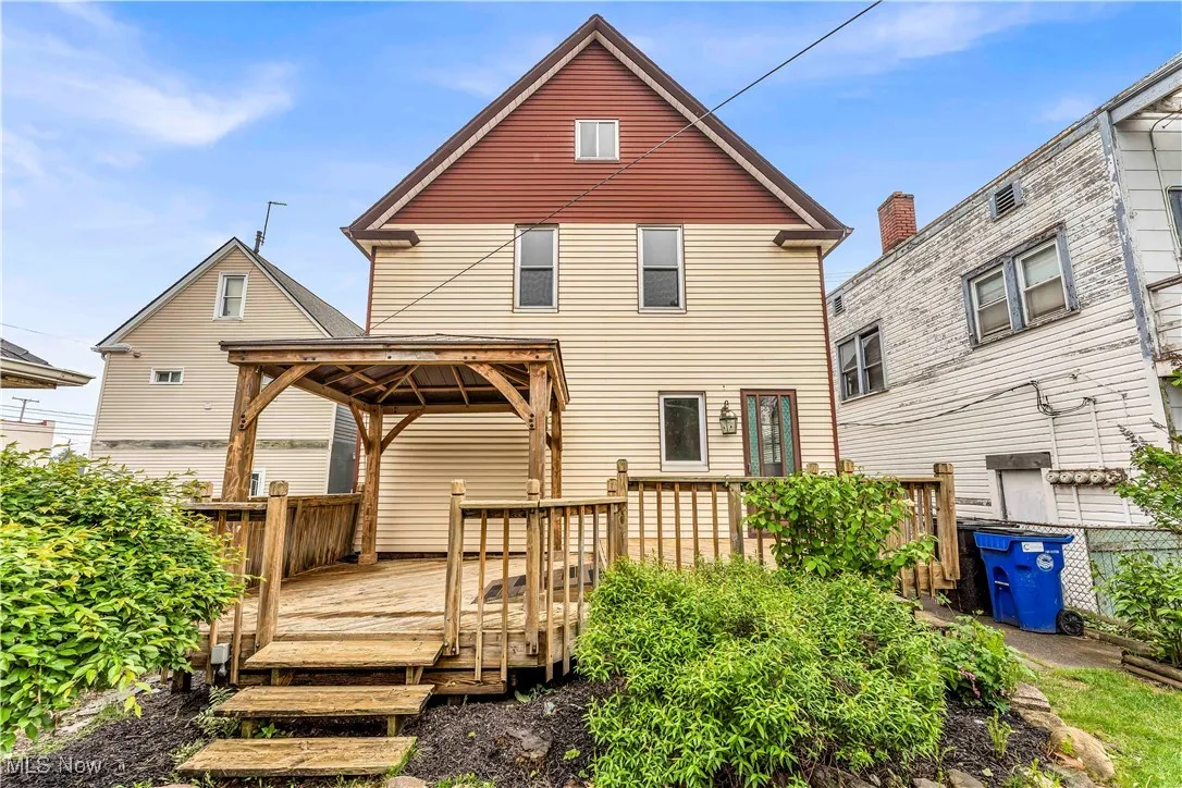 Rear view of house featuring a gazebo and a deck