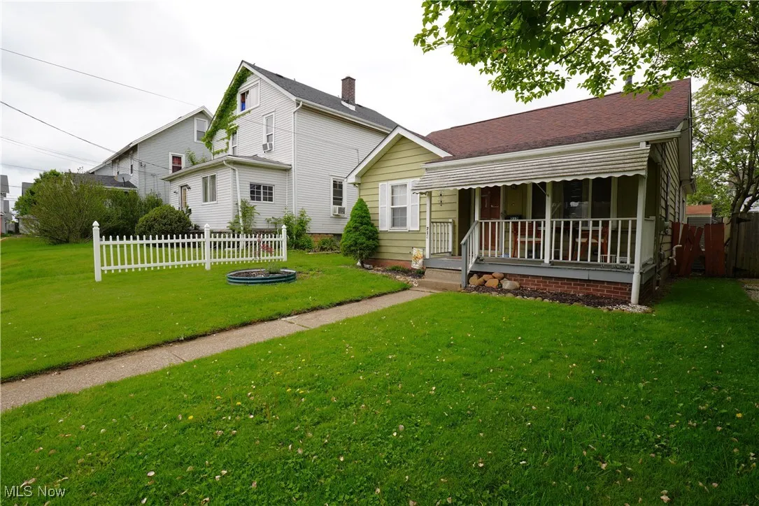 Back of house with covered porch