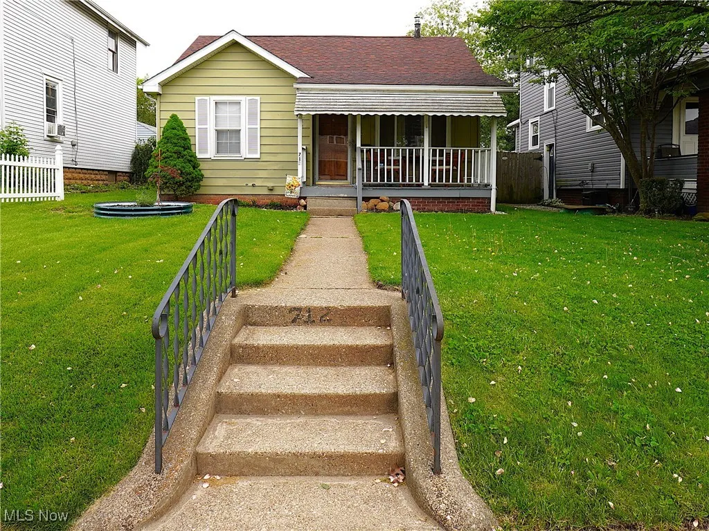 Bungalow-style house featuring a porch and roof with shingles