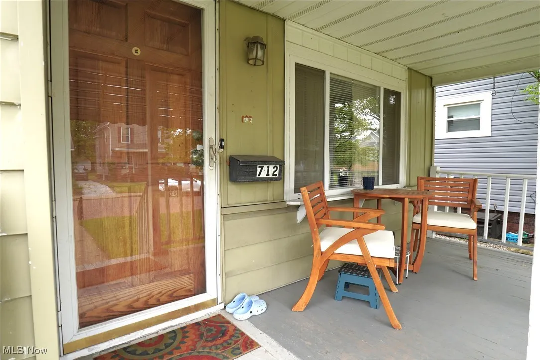 Property entrance featuring covered porch