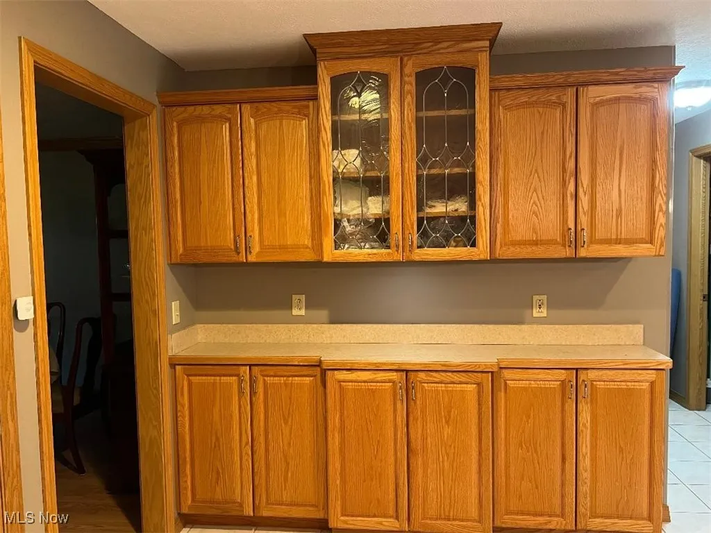 Additional cabinets and countops. Decorative glass doors.