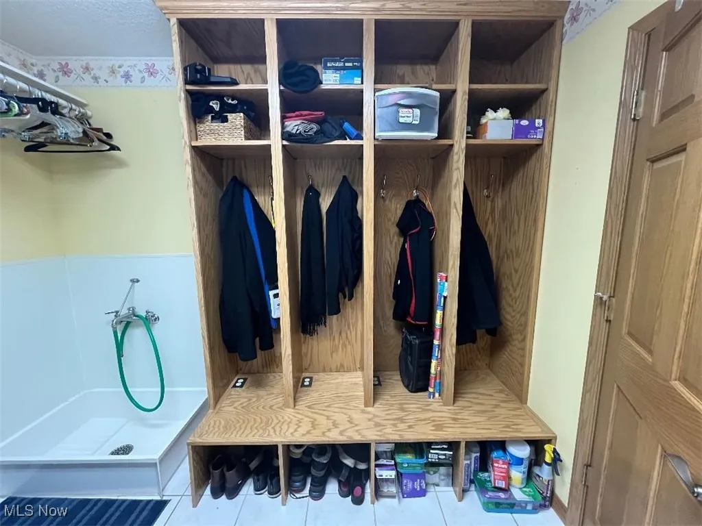 Convenient built-in cubbies near garage and back exit doors features electrical outlets in each unit for charging phones, laptops, etc.!