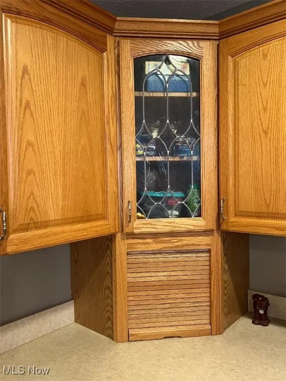 Appliance garage & leaded glass cabinetry.