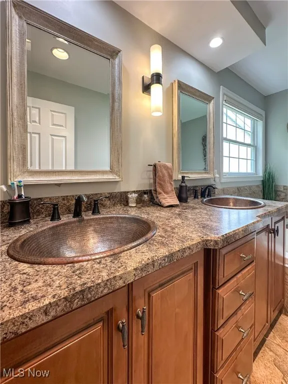 Bathroom featuring double vanity
