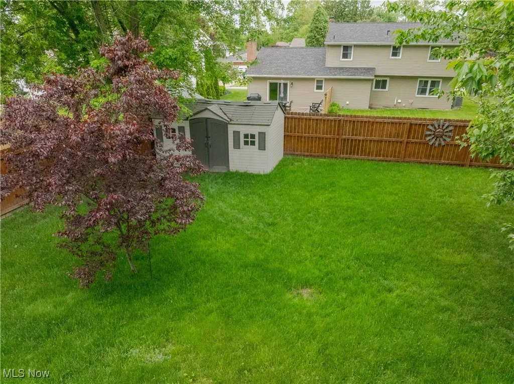 View of yard featuring a shed and an outdoor structure