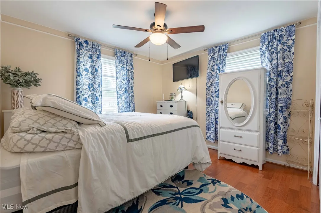 Bedroom featuring light wood-style floors and a ceiling fan