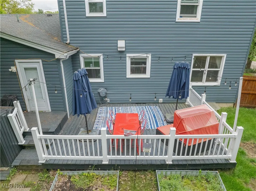 Rear view of property featuring a wooden deck