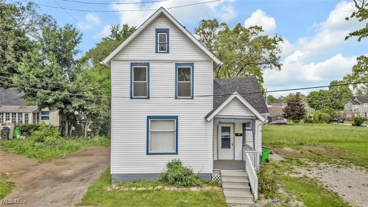 Traditional-style home with a shingled roof