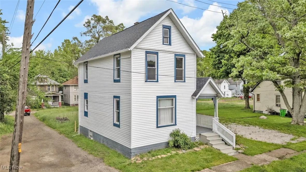 View of front of property featuring roof with shingles