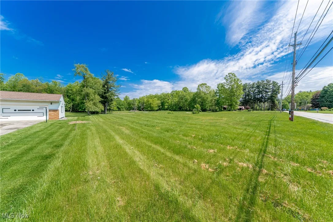 House on the left side of the vacant land