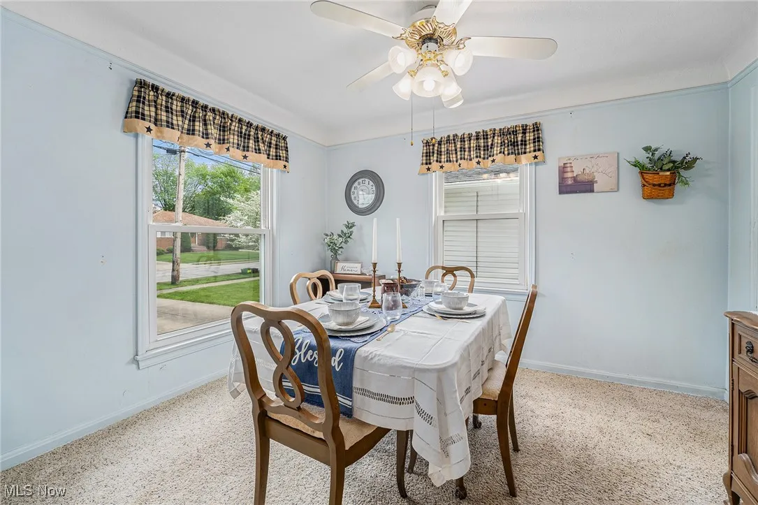 Dining area with baseboards and a ceiling fan
