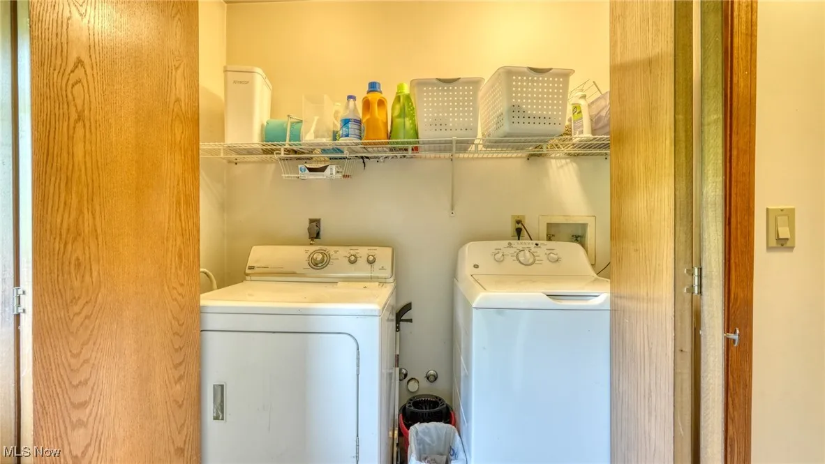 Laundry area with washing machine and clothes dryer