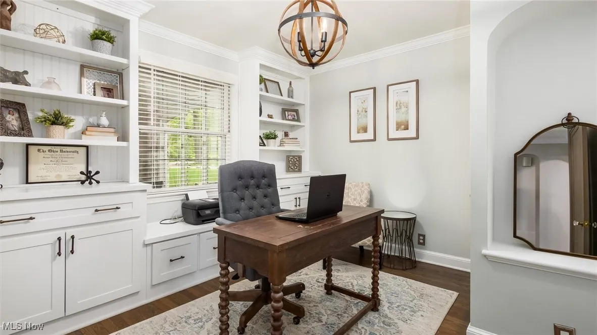 Office featuring ornamental molding, a chandelier, dark wood finished floors, and baseboards