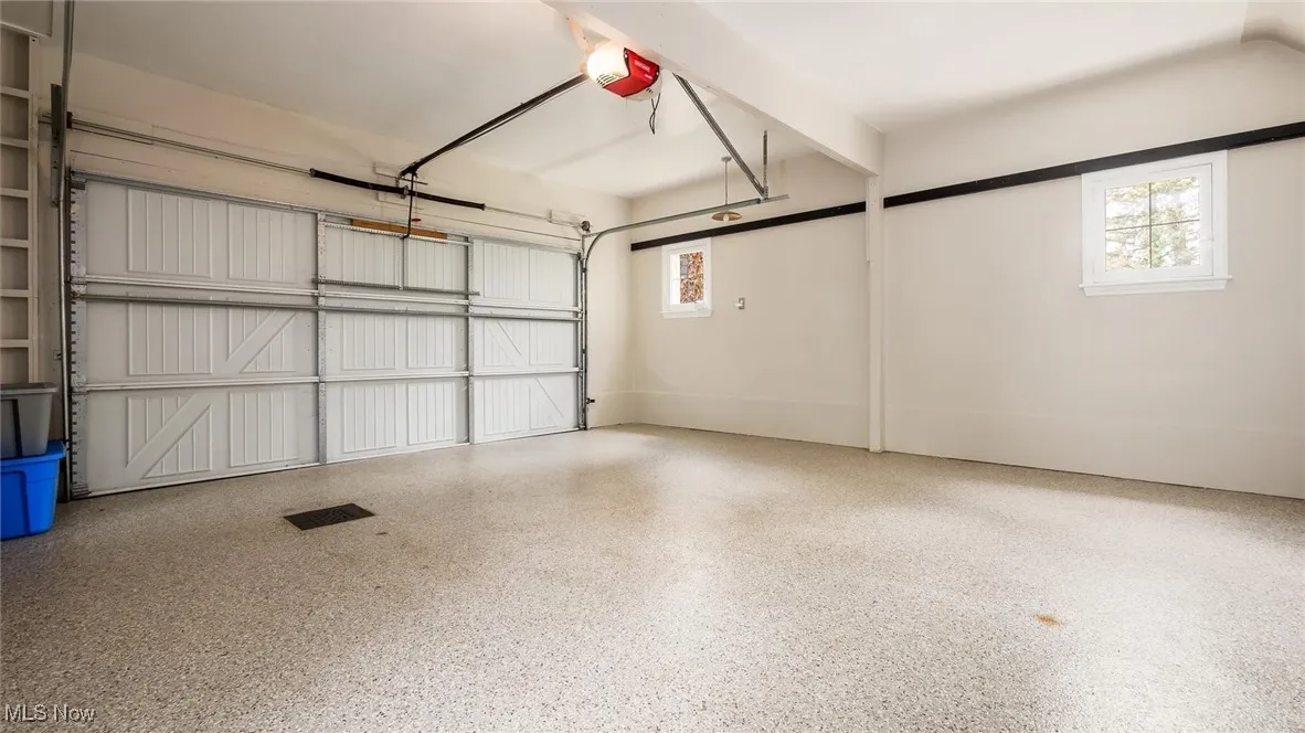 Garage featuring a garage door opener