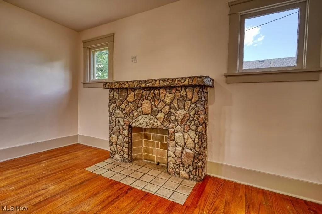 Detailed view of wood finished floors and baseboards