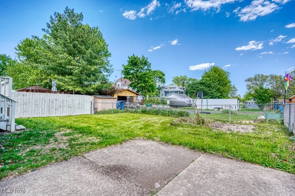 View of yard featuring fence