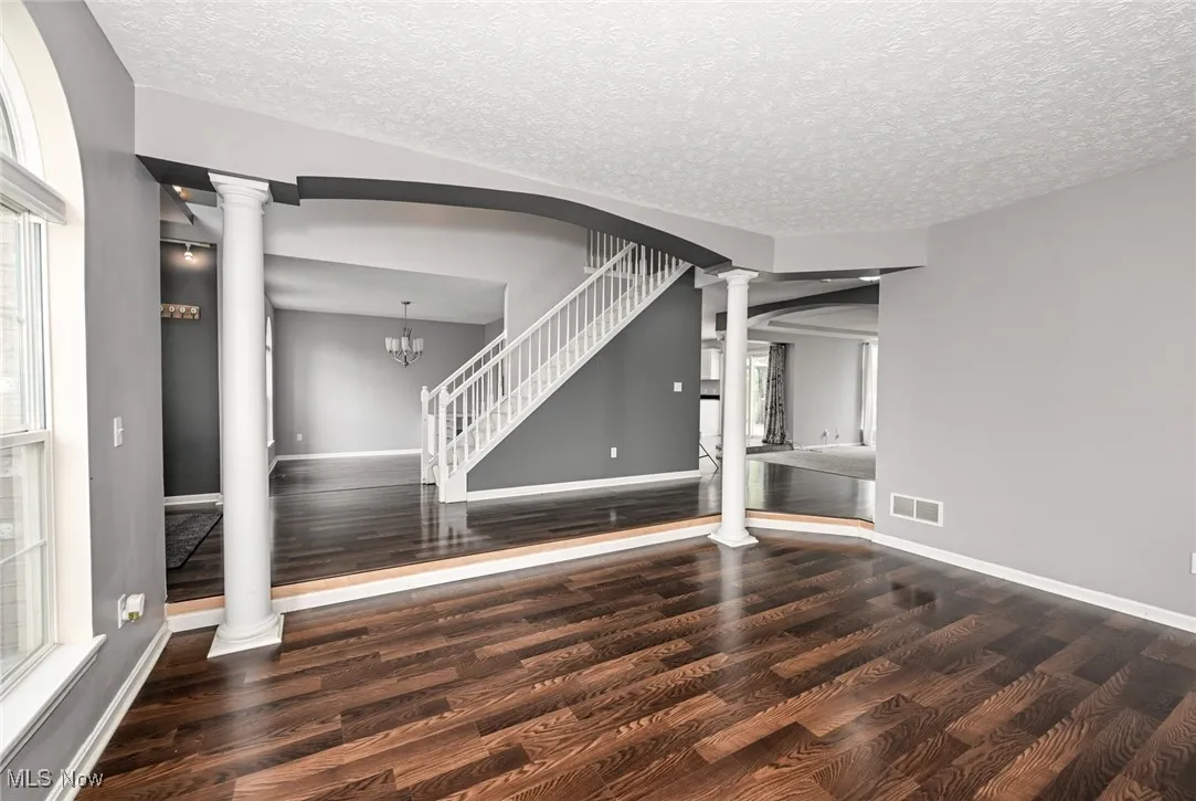 Great room with LVT flooring off of foyer