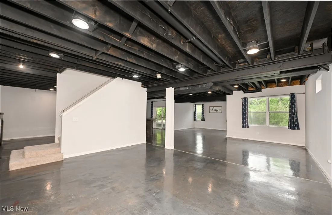 Finished walkout basement with epoxy concrete floors
