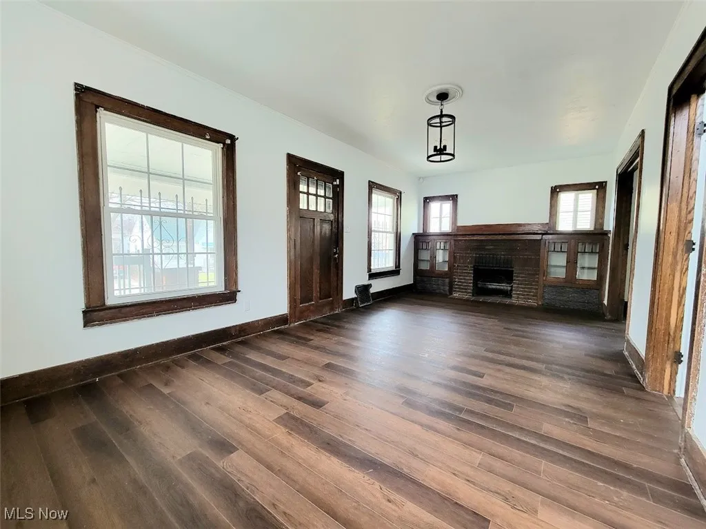 Living room with vinyl flooring and decorative fireplace