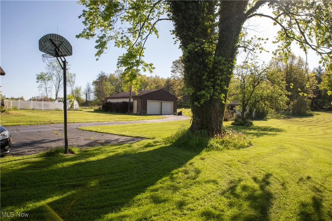 View of yard featuring a garage