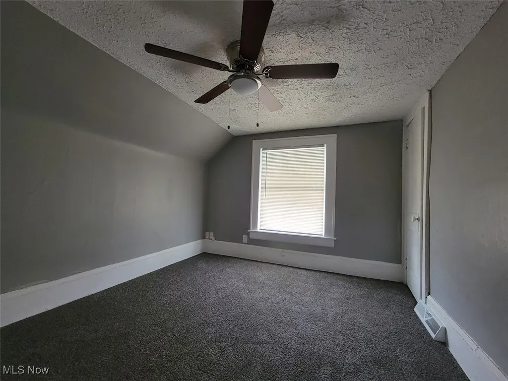 Second floor bedroom with carpet flooring