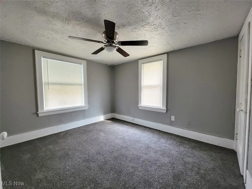 Second floor bedroom with carpet flooring