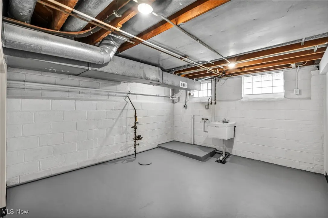 Basement featuring a sink
