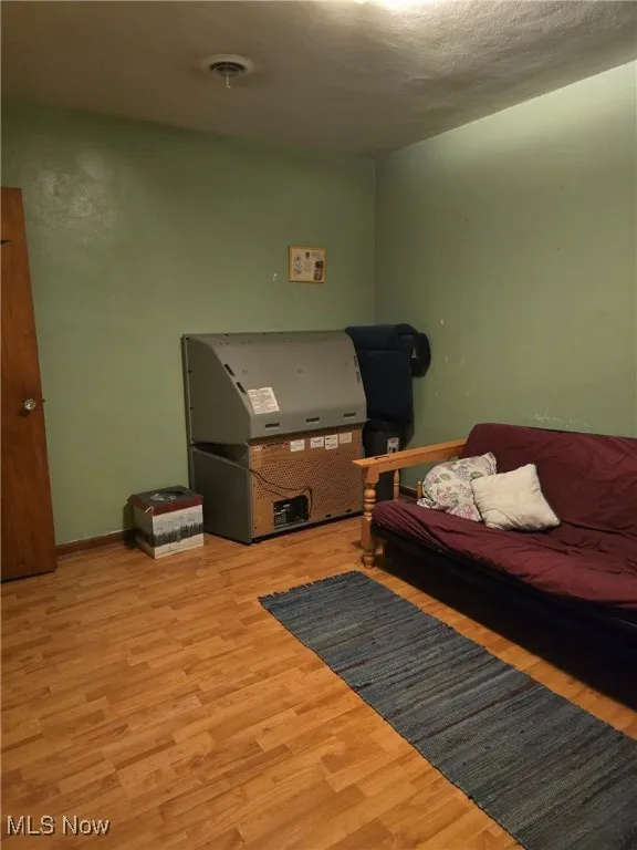 Living room featuring wood finished floors and baseboards