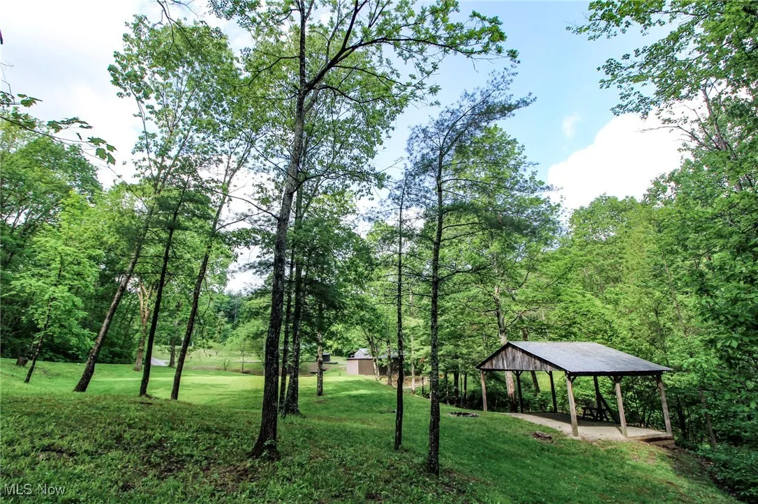 Surrounding community with a gazebo, a lawn, and a carport