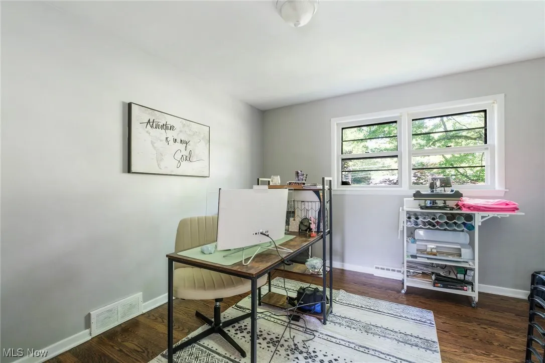 Office area with wood finished floors and baseboards