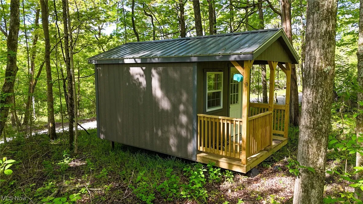 View of outbuilding with an outdoor structure