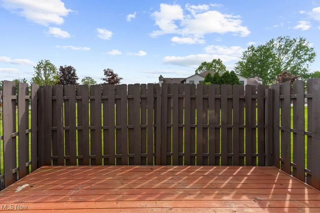 Wooden deck featuring fence