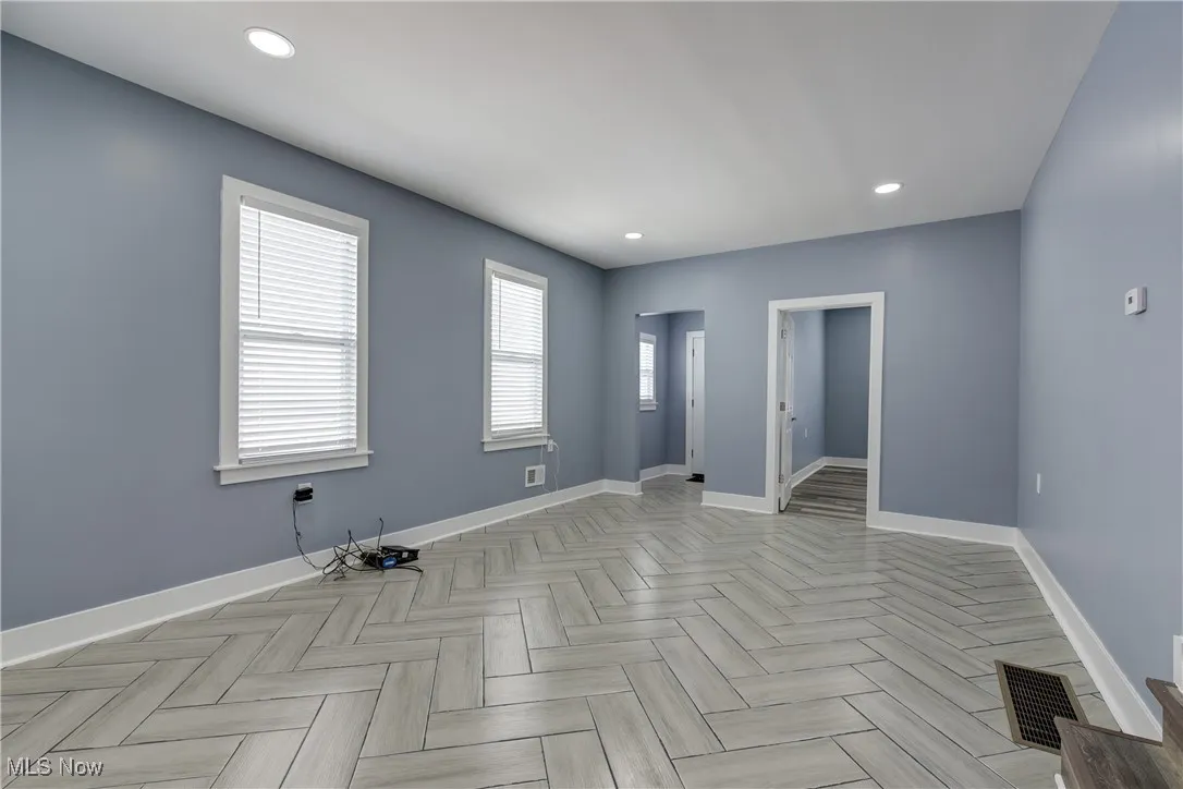 Unfurnished room featuring baseboards and recessed lighting
