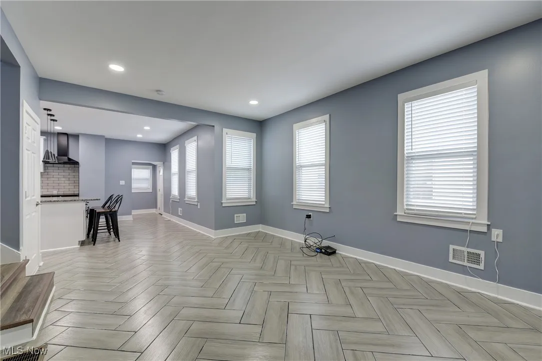Unfurnished room with baseboards and recessed lighting