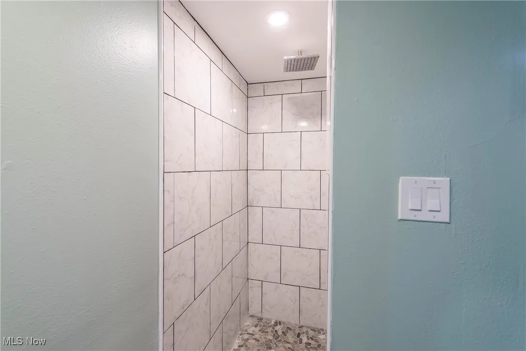 Bathroom with tiled shower